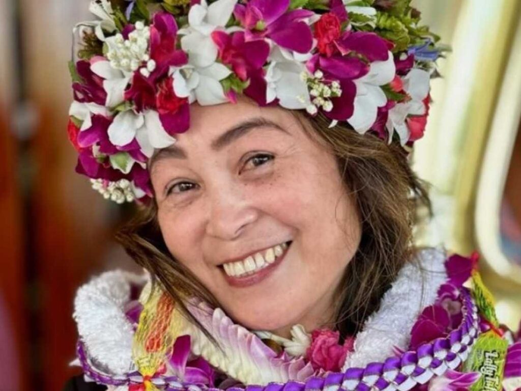 Maravic smiling with beautiful flowers in her hair